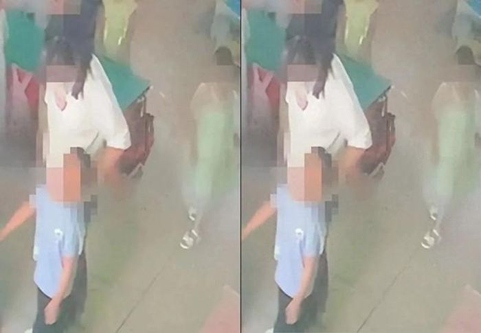 Hình ảnh camera ghi lại cho thấy bé trai bị một giáo viên nắm tóc kéo từ phía sau. Ảnh: Douyin.